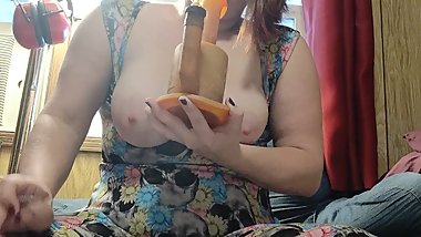 Sexy redhead takes a dab with her tits out