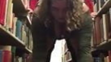 Lesbians fuck in library with strapon