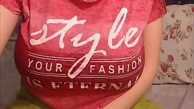 Busty sexy with glasses penetrates her wet pussy with a dildo in her bedroom